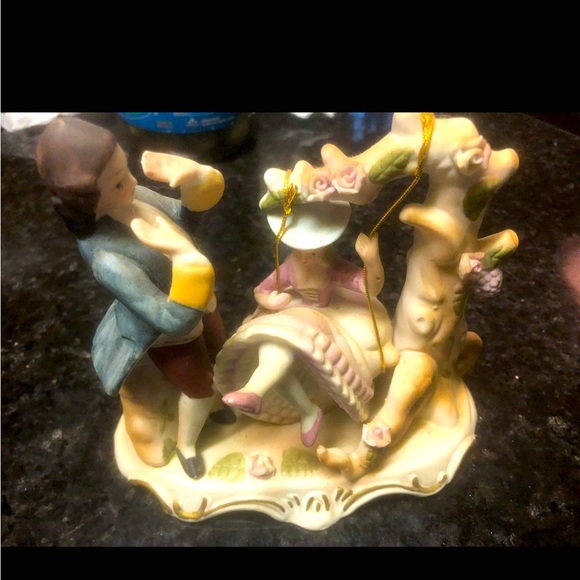 Other - Vintage stature of a gentleman dressed in tails next to a lady on a swing.